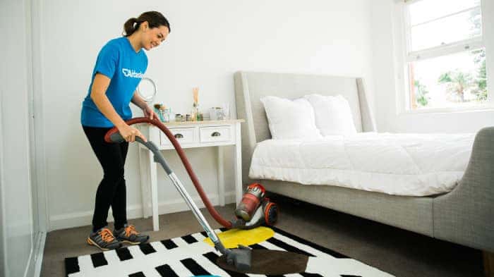 woman cleaning carpet