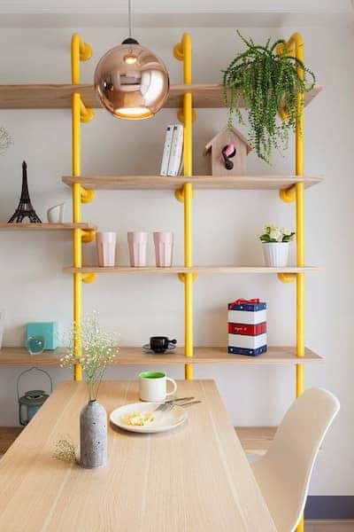 interior-design-ideas-dwell-tube-bookcases-diy-wohnideen-yellow-shelves