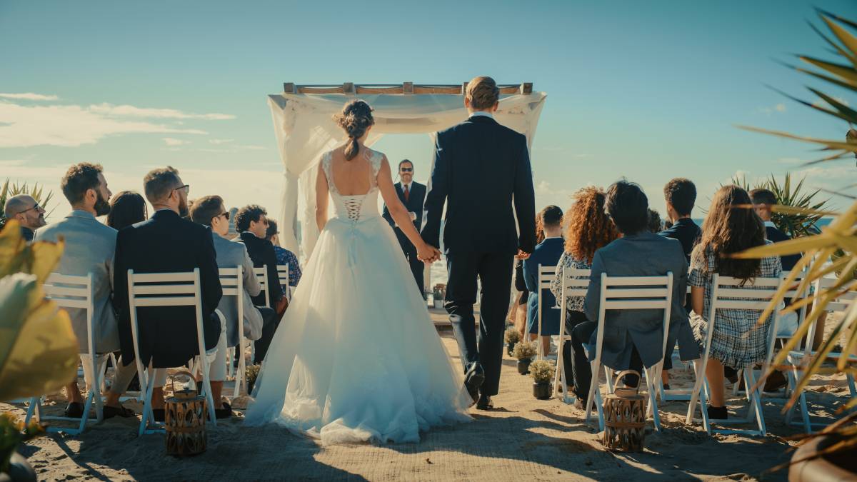 bride and groom walking down the aisle at an outdoor wedding ceremony