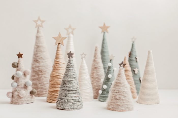 handmade yarn cone Christmas trees in natural colors.