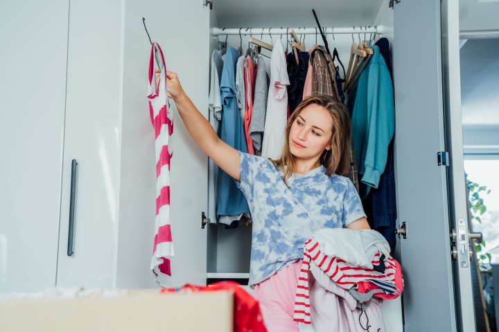 woman decluttering her clothes