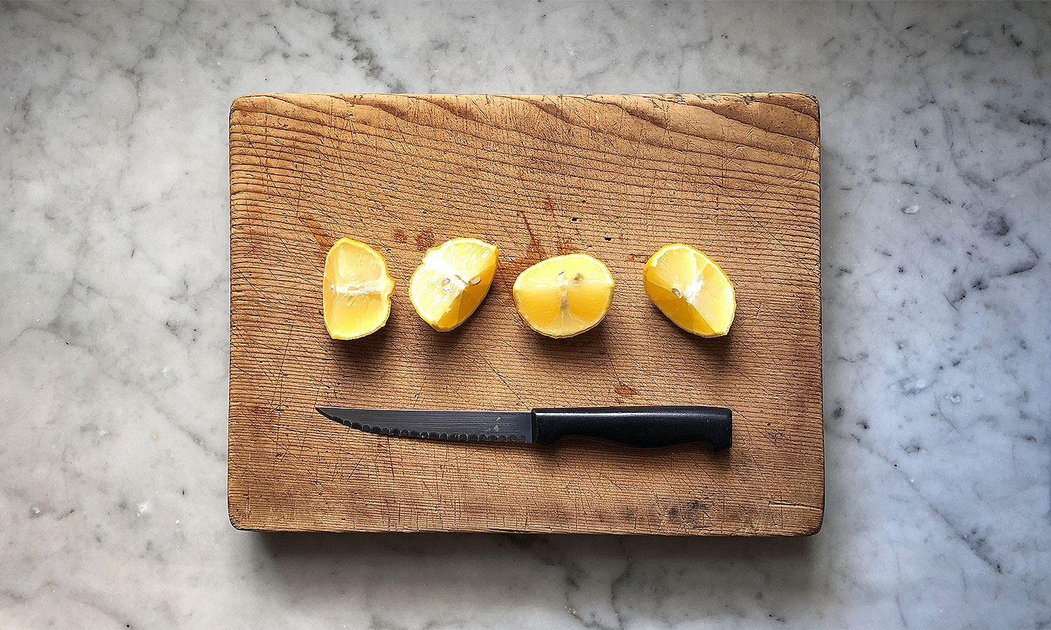 chopped lemons on marble benchtop