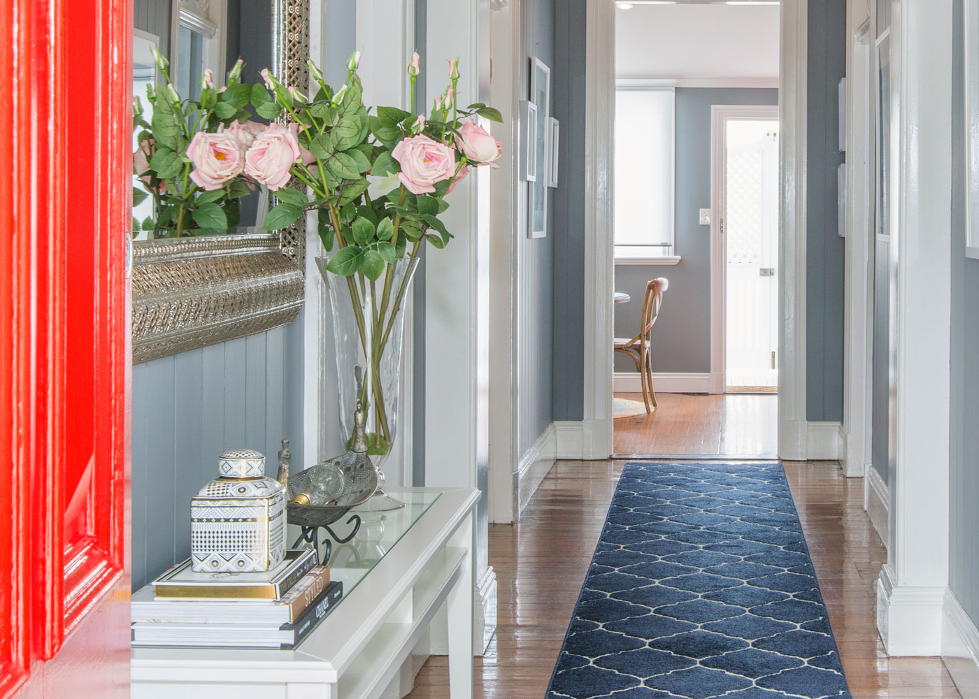 Brisbane Airbnb hallway red door pink flowers