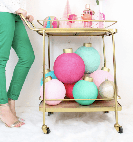 gold bar cart with giant Christmas baubles