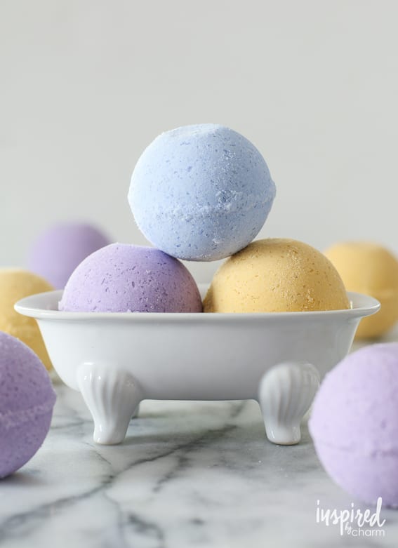 pastel bath bombs in ceramic bath