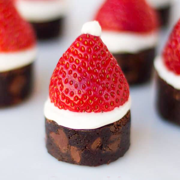 Brownie bites with strawberry Santa hats