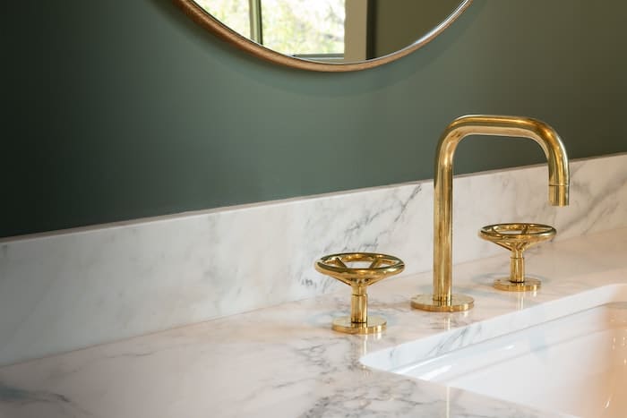 brass taps in bathroom