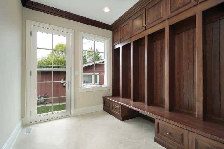 Mudroom in new construction home with wood cabinetry