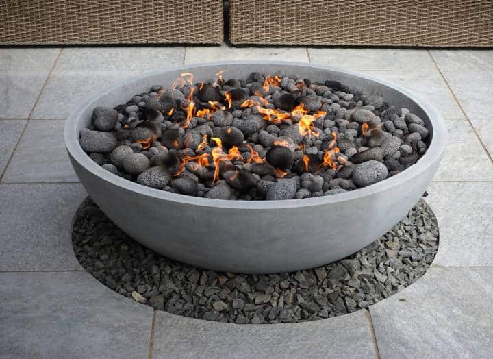 modern fire pit bowl on backyard patio