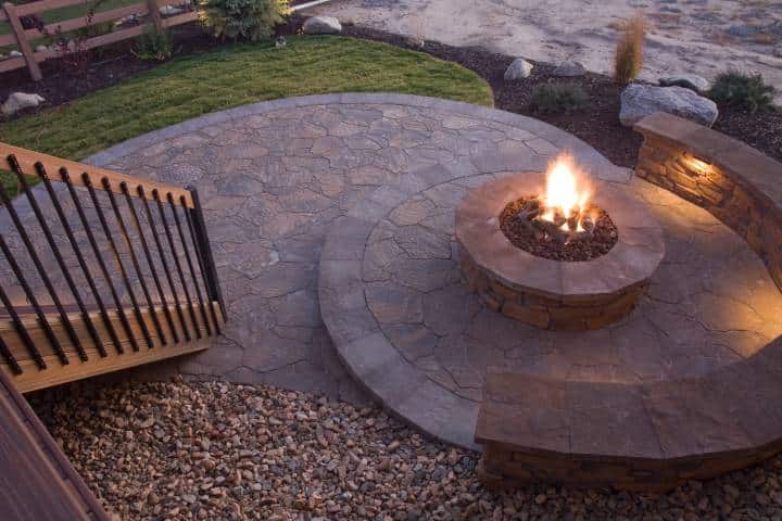 Beautiful fire pit at dusk with hidden wall lights