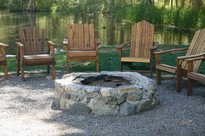 circular irregular brick fire pit with chairs around