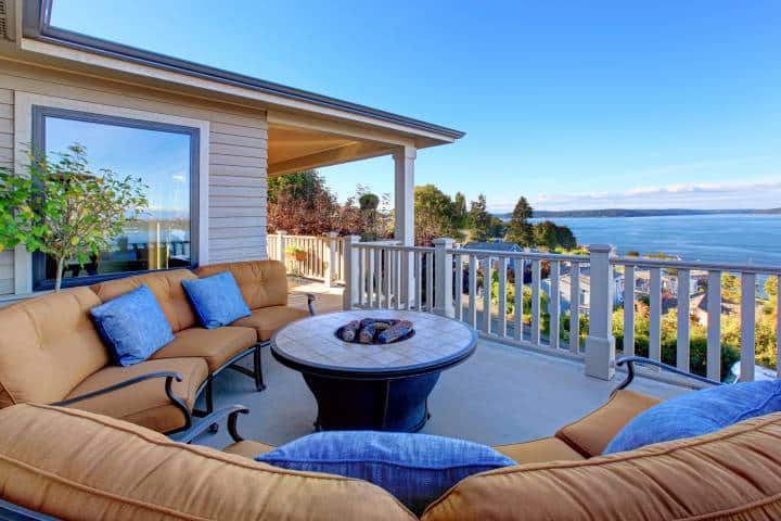 Cozy patio area with comfort settees and fire pit