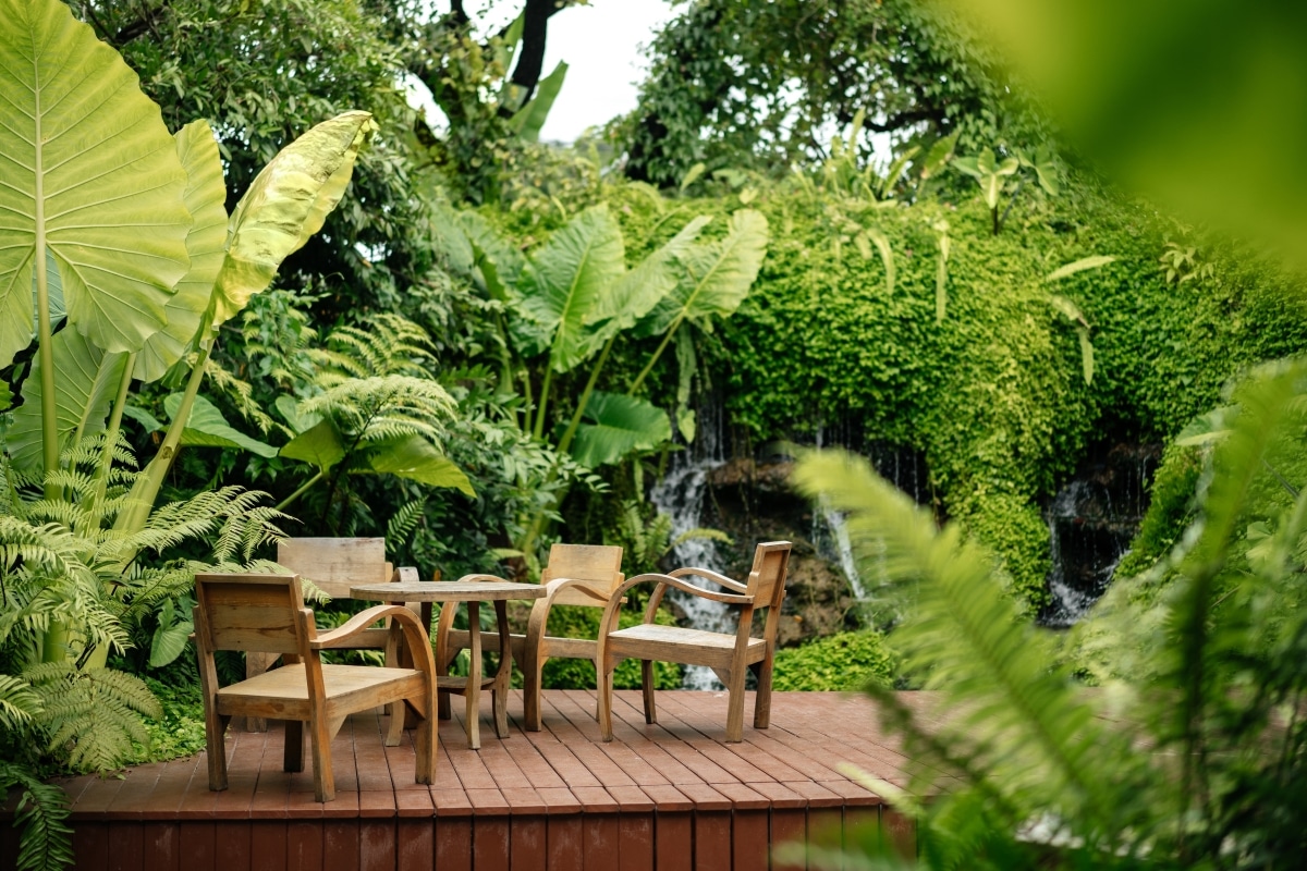 lush greens surrounding wooden patio