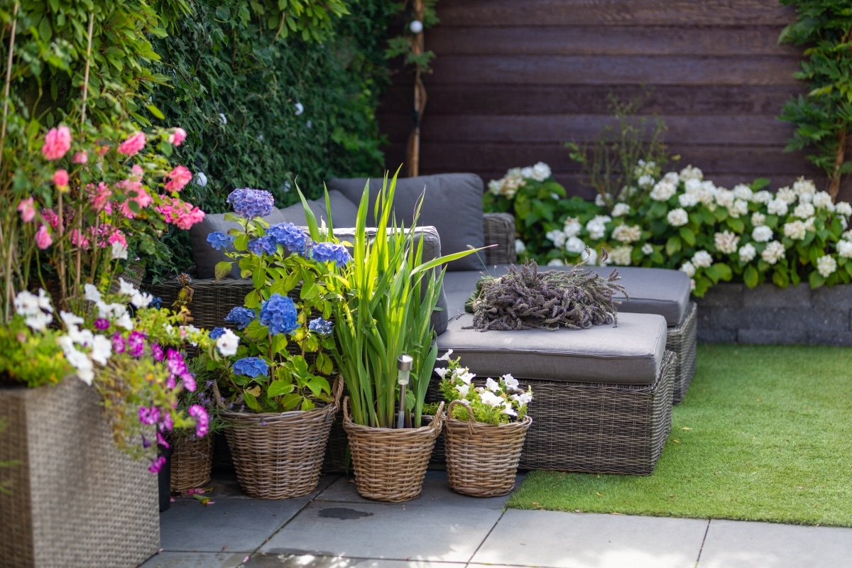 patio with flowers in rattan baskets