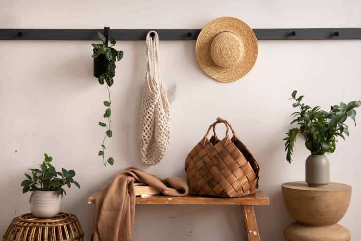 scandi style mudroom with hat hanger and table