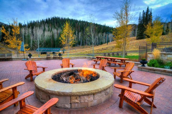 outdoor stone fire pit and chairs