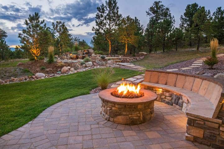 fire pit with wooden bench