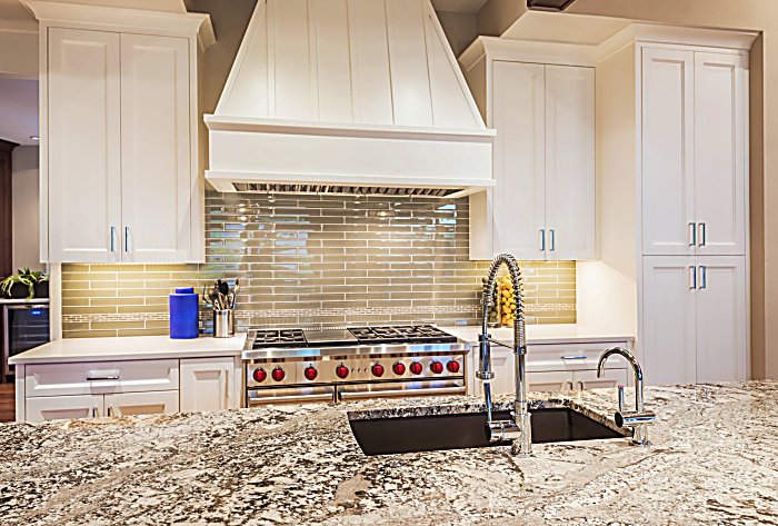 Luxury Kitchen Detail: Island, Counter-top, Sink, Cabinets, Range, and Oven