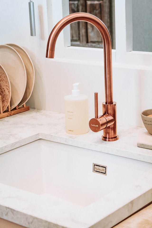 copper and brass in white kitchen