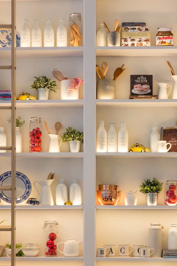 in-built white shelving in kitchen