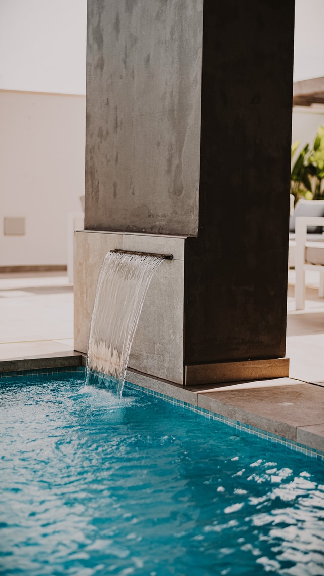 pool landscaping with waterfall