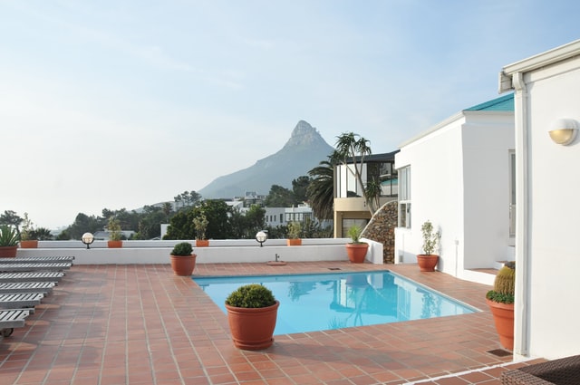 pool landscaping with pots