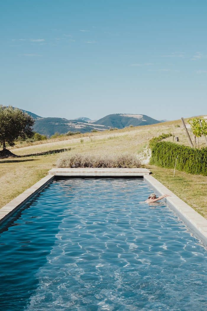 pool in backyard with grass