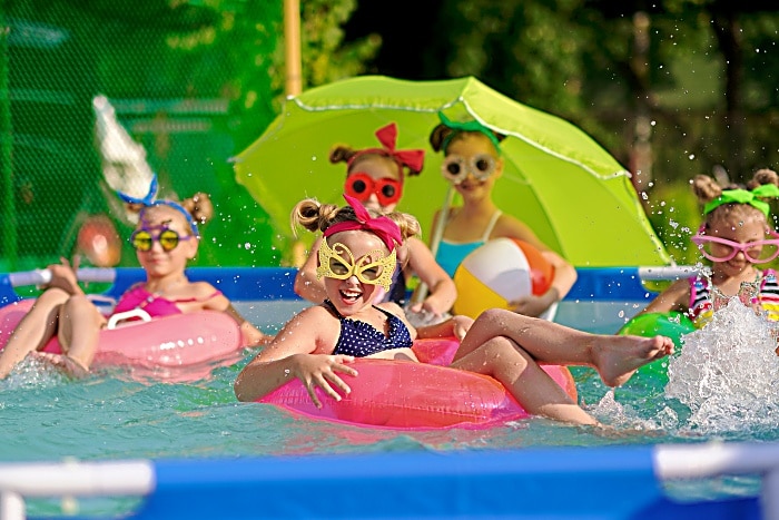 Portrait of children on the pool in summer