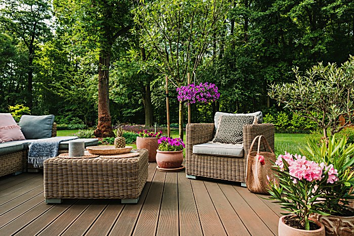 Elegant garden furniture on terrace of suburban home