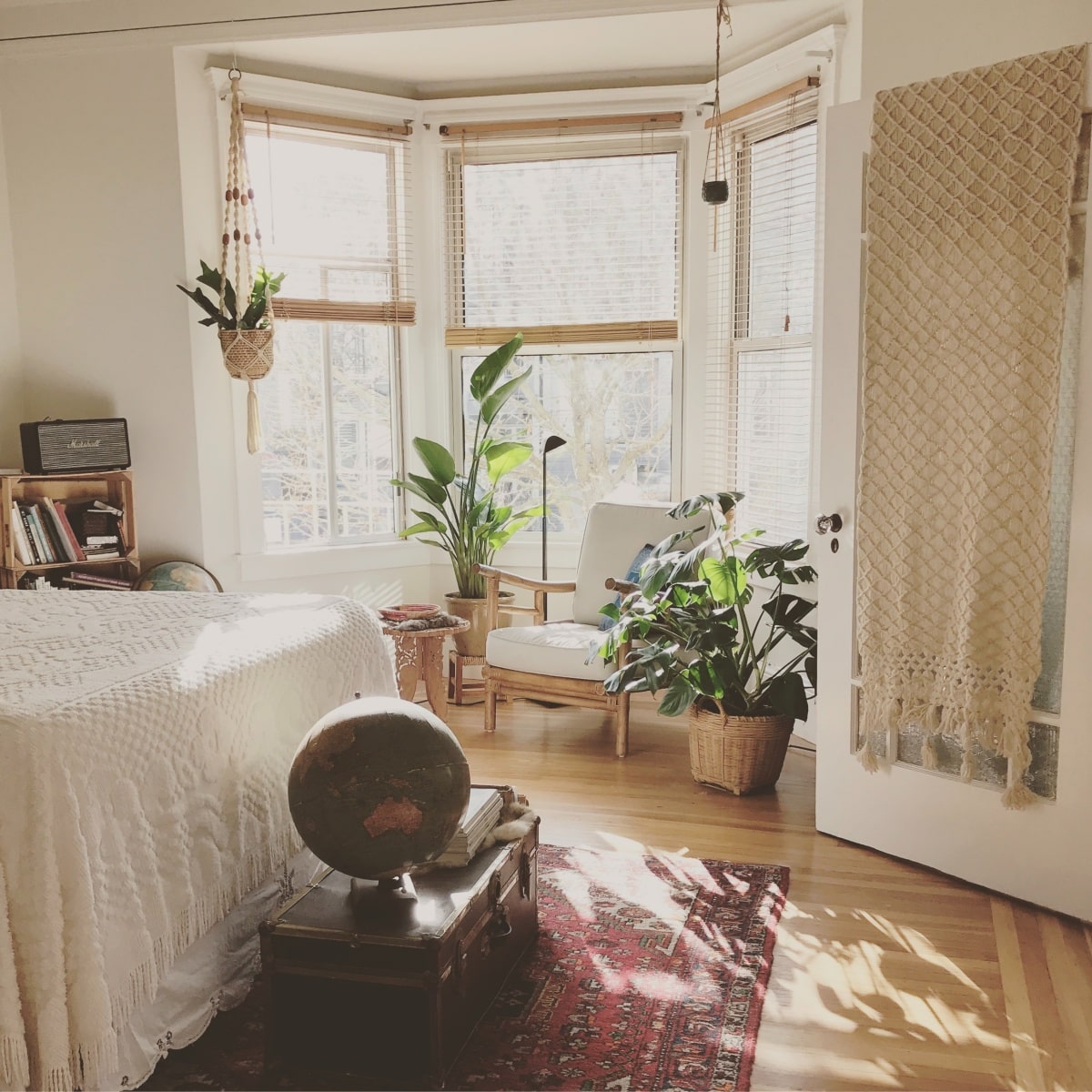 Boho touches on mid century modern bedroom