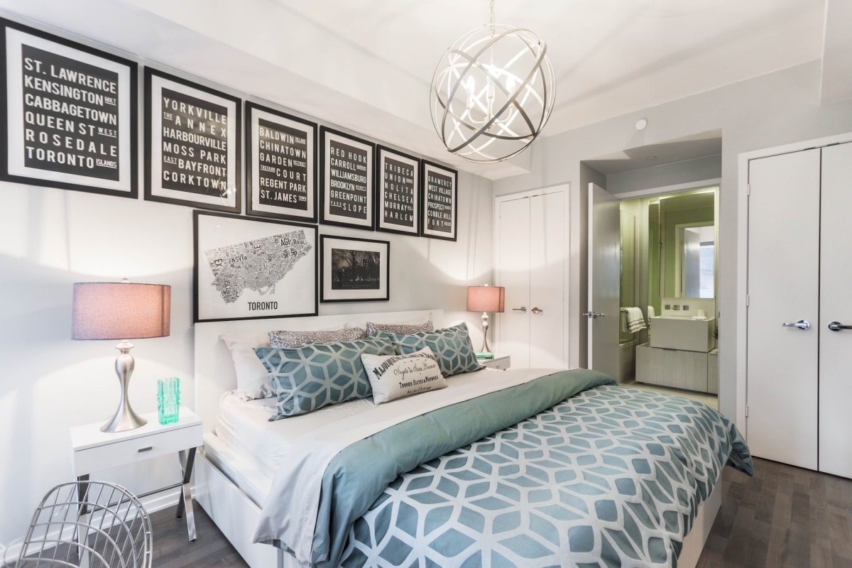 Mid century bedroom idea with multiple picture frames