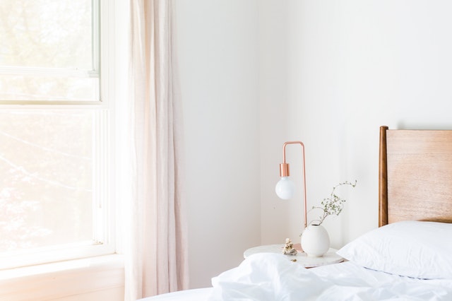 white bedroom with rose gold touch