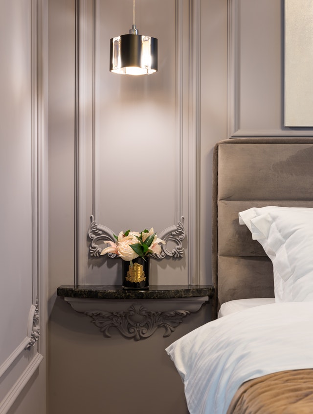 bedroom with warm greys and silver