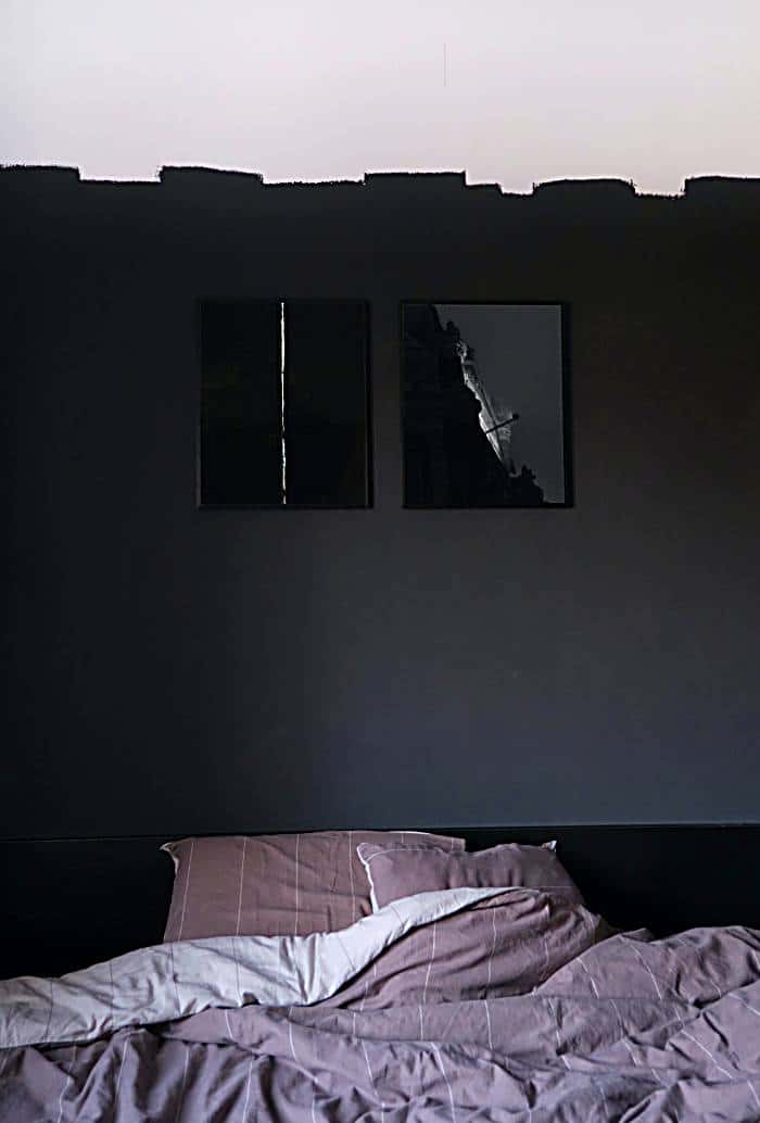 dark frames in black bedroom
