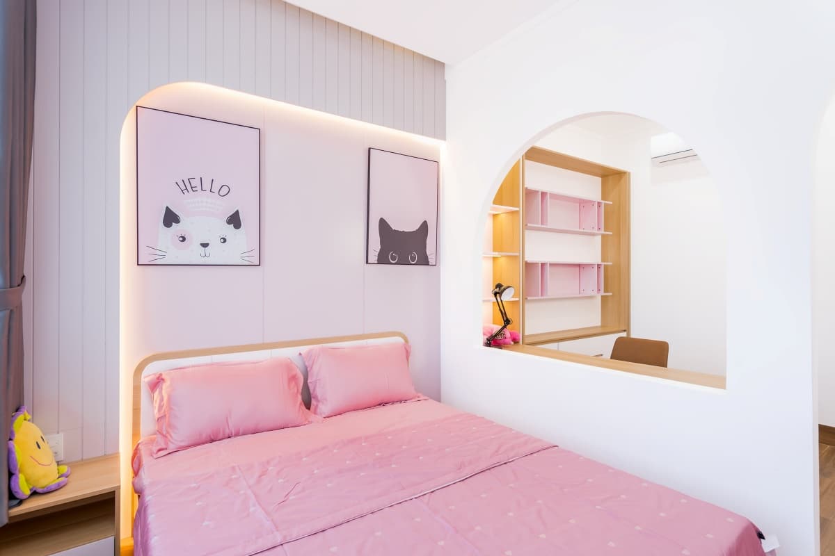 blush pink bedroom with wood accents and cat posters