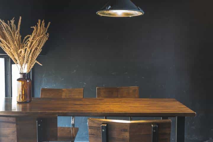 Dark dining table with wooden chairs