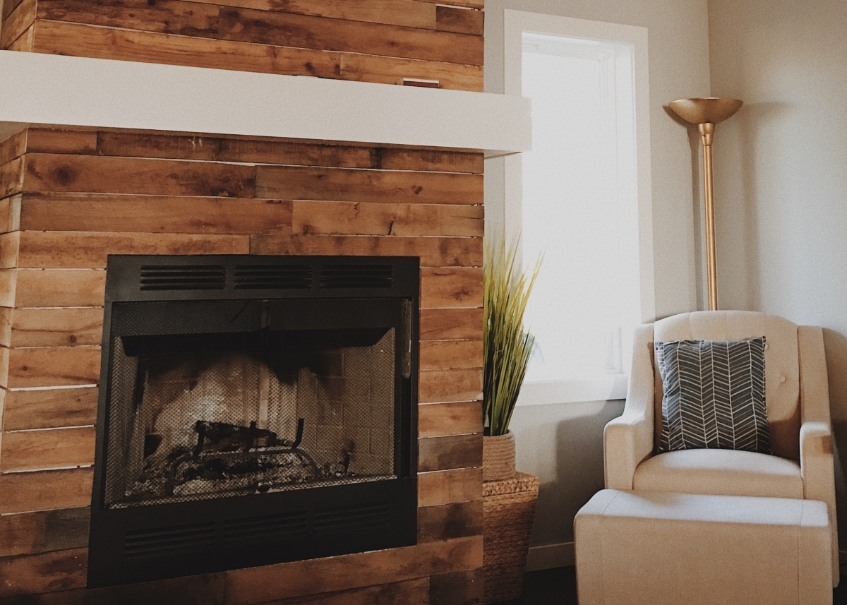 inset wall fireplace with wood chimney