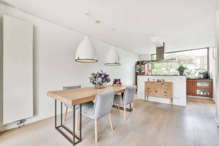 Minimalist dining room with light pendants