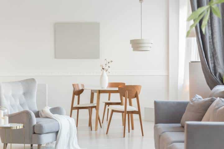 Round dining room table with neutral tones