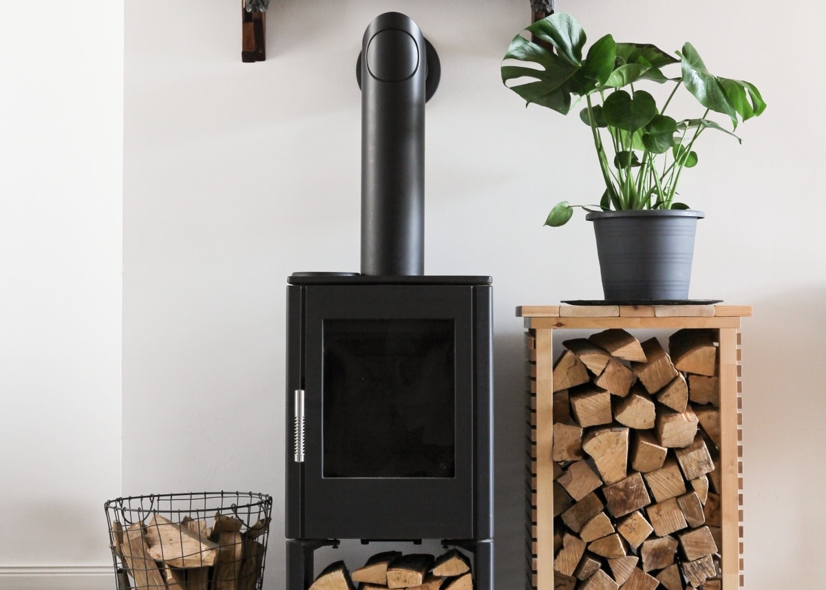 firewood rack by standalone fireplace