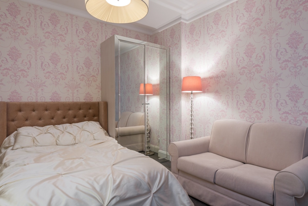 Comfortable bedroom in modern flat