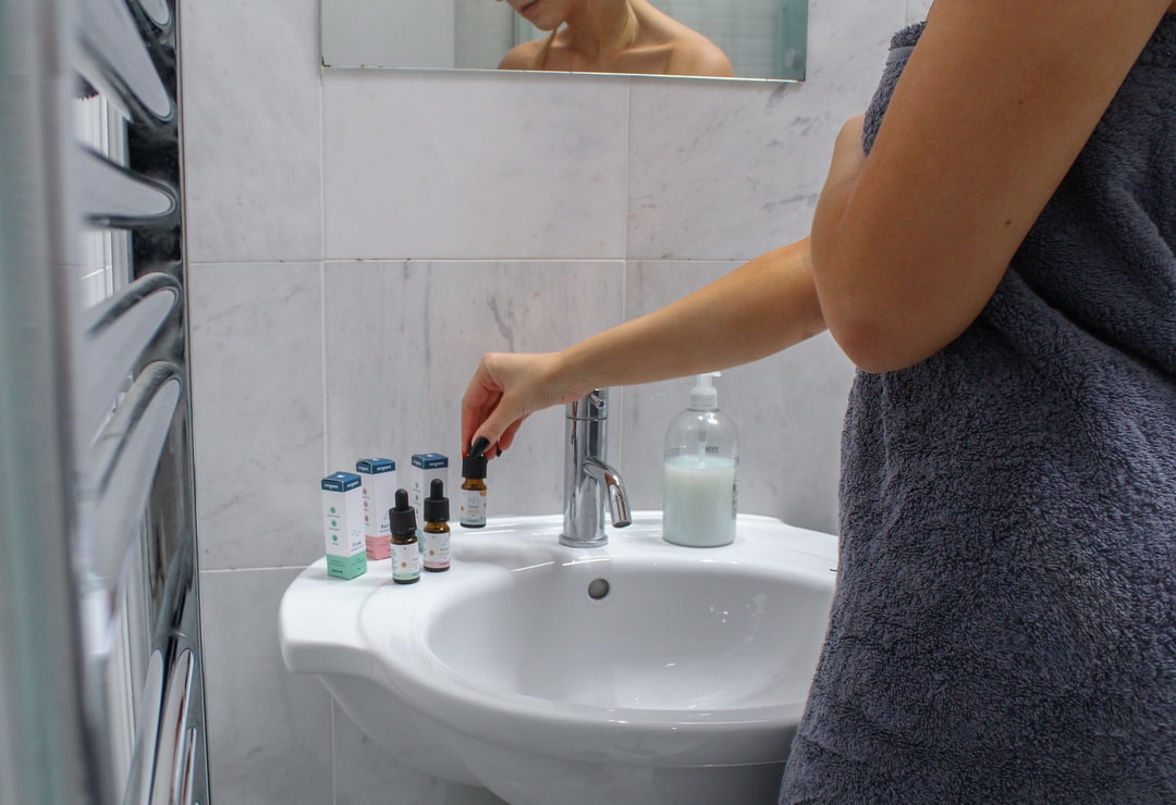 Woman standing with sink