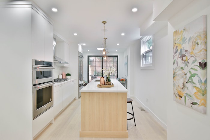 narrow kitchen with black trim window