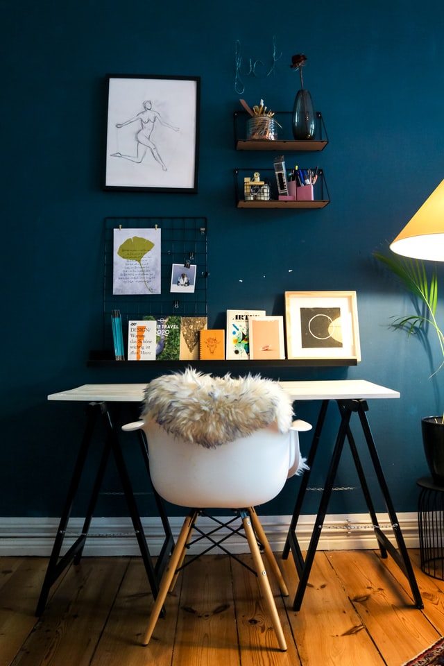 modern home office with deep blue feature wall