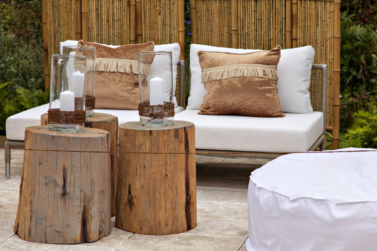 cosy seating area with white cushions in a garden
