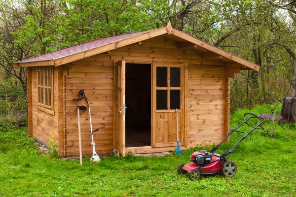 open garden shed with gardening tools