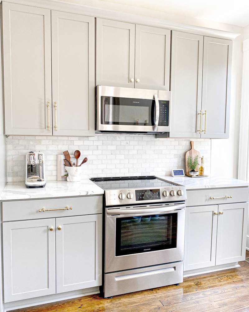 clean white kitchen with white splashback