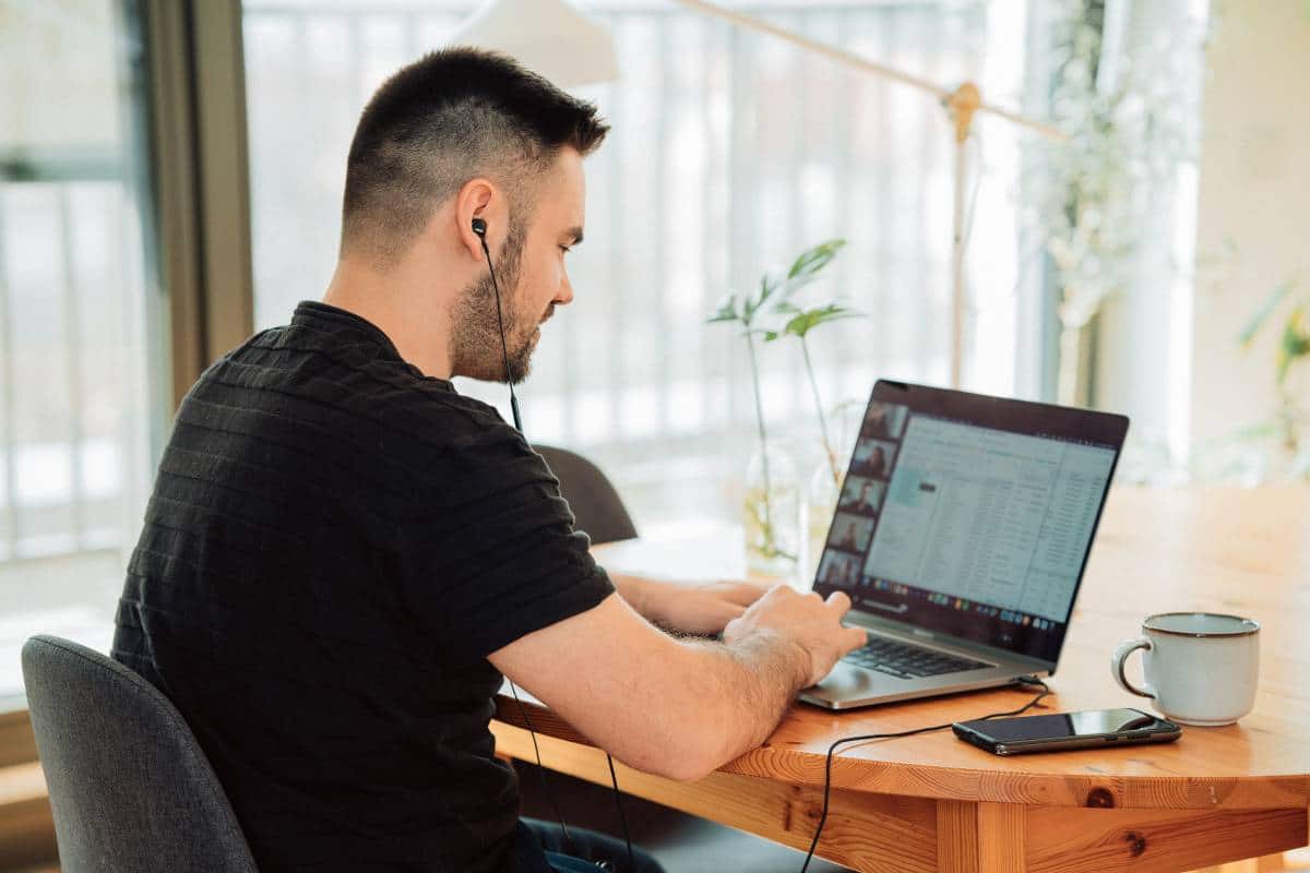 man attending an online meeting