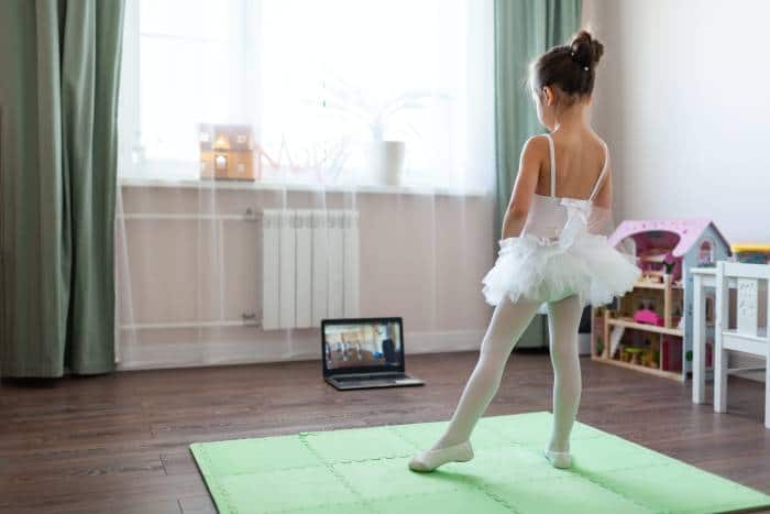 girl taking online ballet classes at home