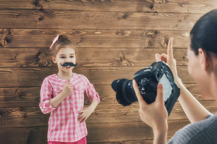 little girl posing in front of camera